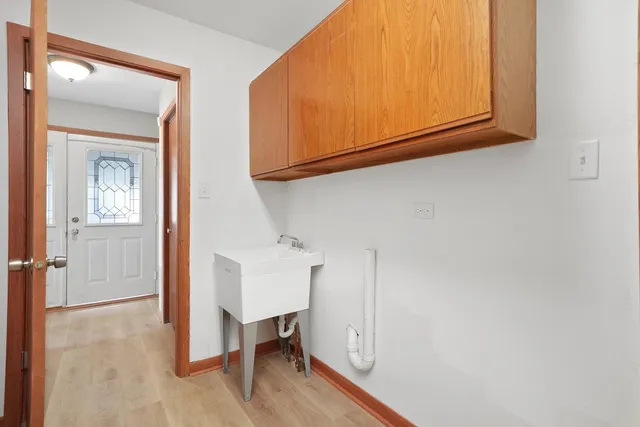 a view of an entryway with wooden floor