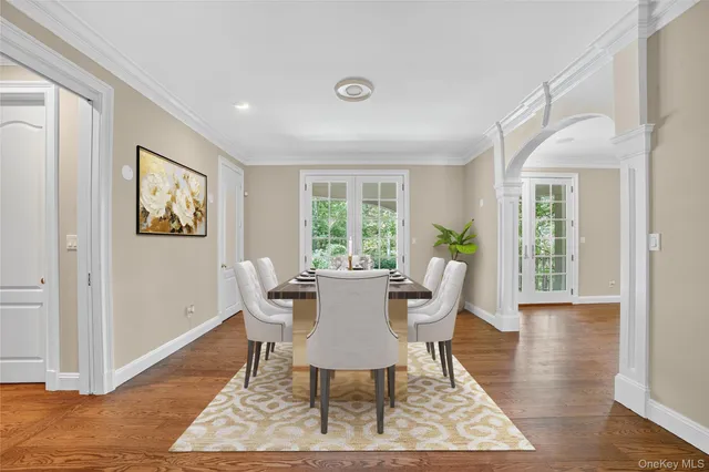a view of a dining room with furniture wooden floor and a rug