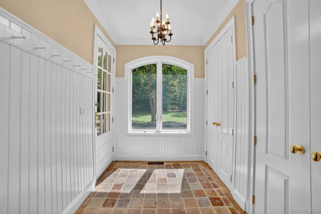 a view of a hallway with windows