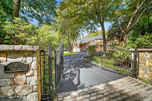 a view of a yard with yellow trees