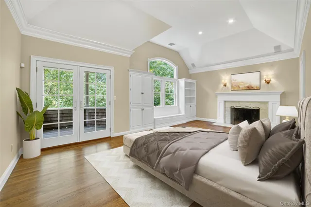 a spacious bedroom with a large bed and a couch