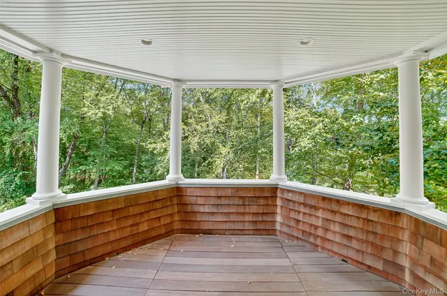 a view of room with window and wooden floor