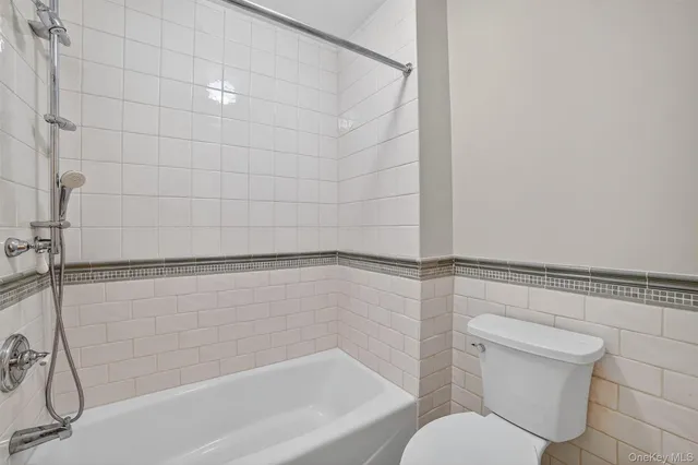 a bathroom with a shower and a toilet