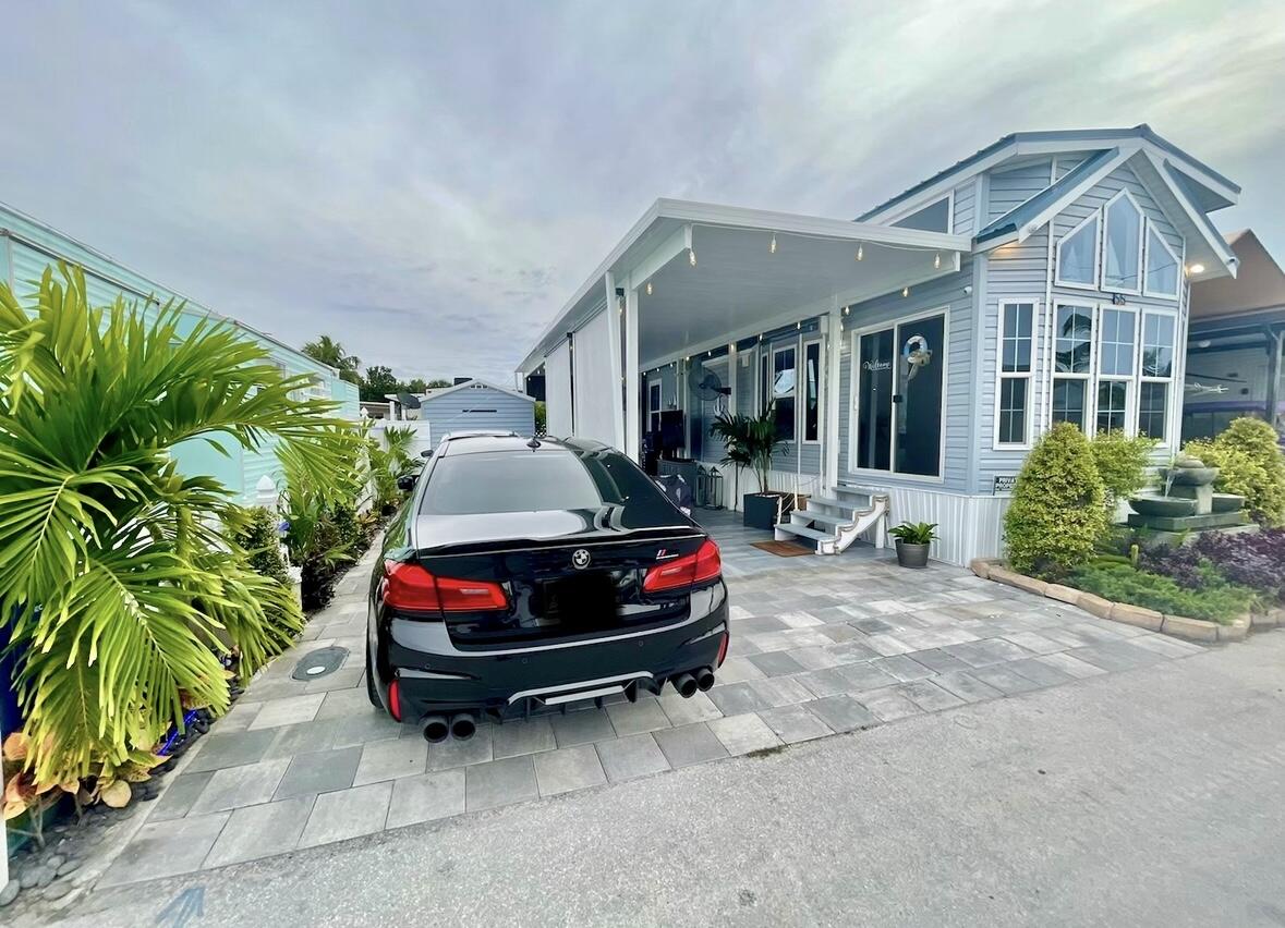 a backyard of a house with outdoor seating