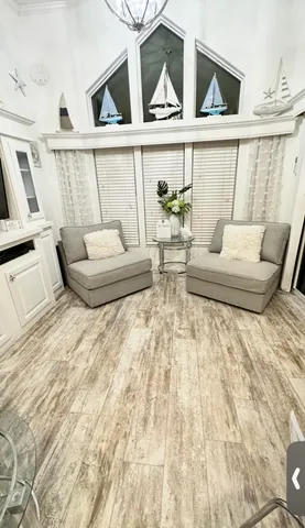 a view of living room with furniture and window