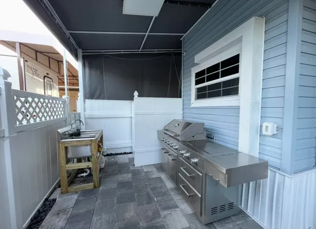 a kitchen with a stove and a refrigerator