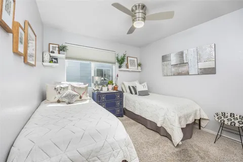 a bedroom with double bed and a table