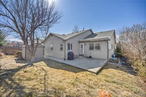 a view of a house with snow on the background