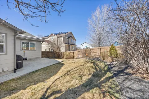 a view of a house with a snow in the yard
