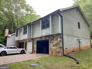 1117 Boss Hardy Road Auburn, GA 30011 - Photo 3 of 19 a view of multiple house with a yard