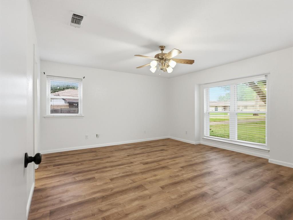 209 Valley View Court Azle, TX 76020 - Photo 26 of 39 Unfurnished room with a ceiling fan and dark wood-style flooring
