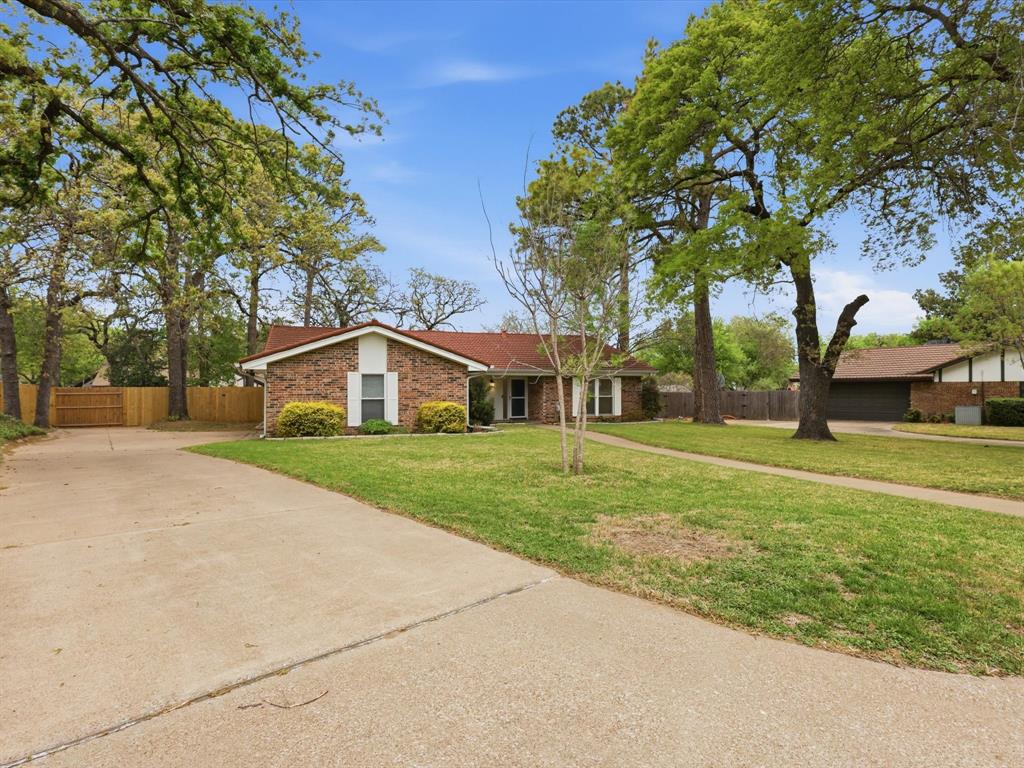 209 Valley View Court Azle, TX 76020 - Photo 3 of 39 View of front of house featuring concrete driveway and brick siding