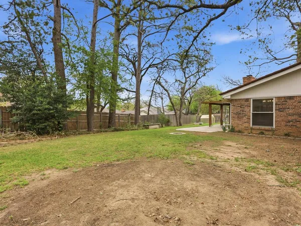 a backyard of a house with lots of green space