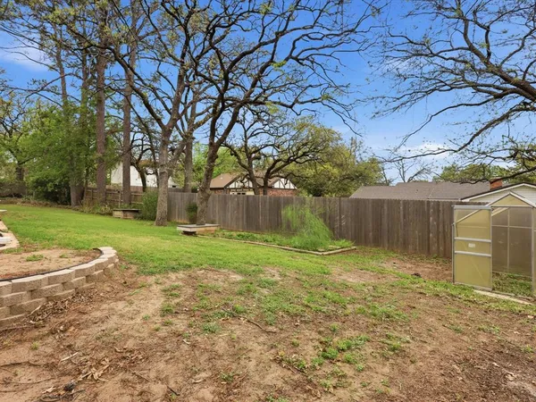 a backyard of a house with lots of green space