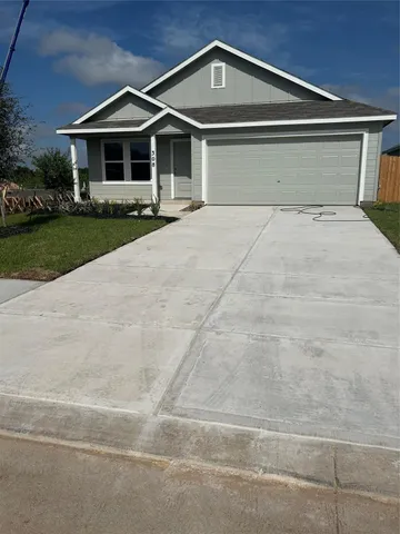 a front view of a house with yard