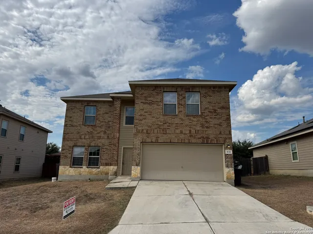 a front view of a house with yard