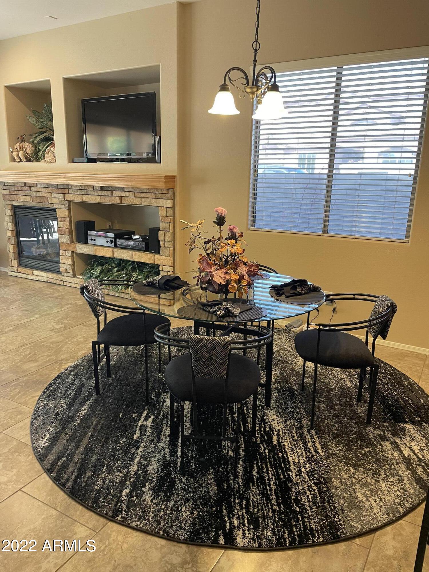 4604 West Moss Springs Road Phoenix, AZ 85086 - Photo 4 of 15 a view of a dining room with furniture