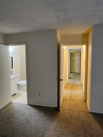 a view of a bathroom with a tub and a bathroom