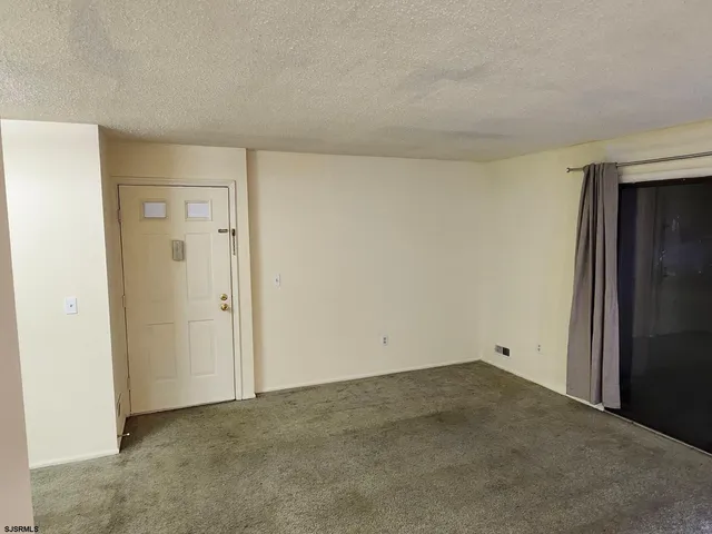 an empty room with closet area