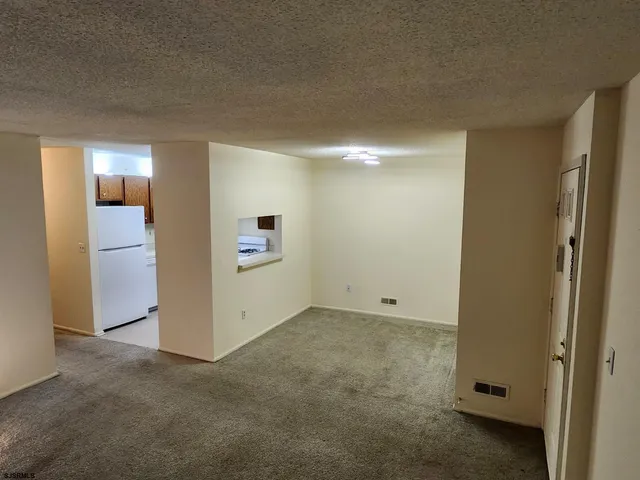 an empty room with closet area
