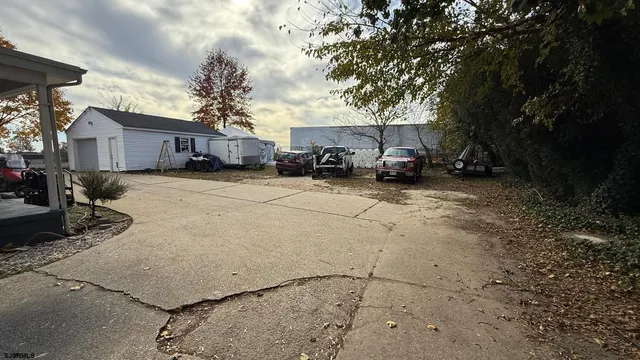 a view of a house with a snow in the yard