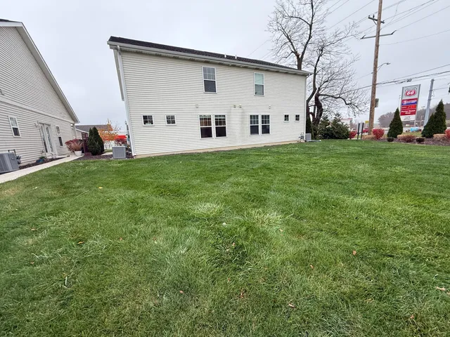 a view of a backyard of the house