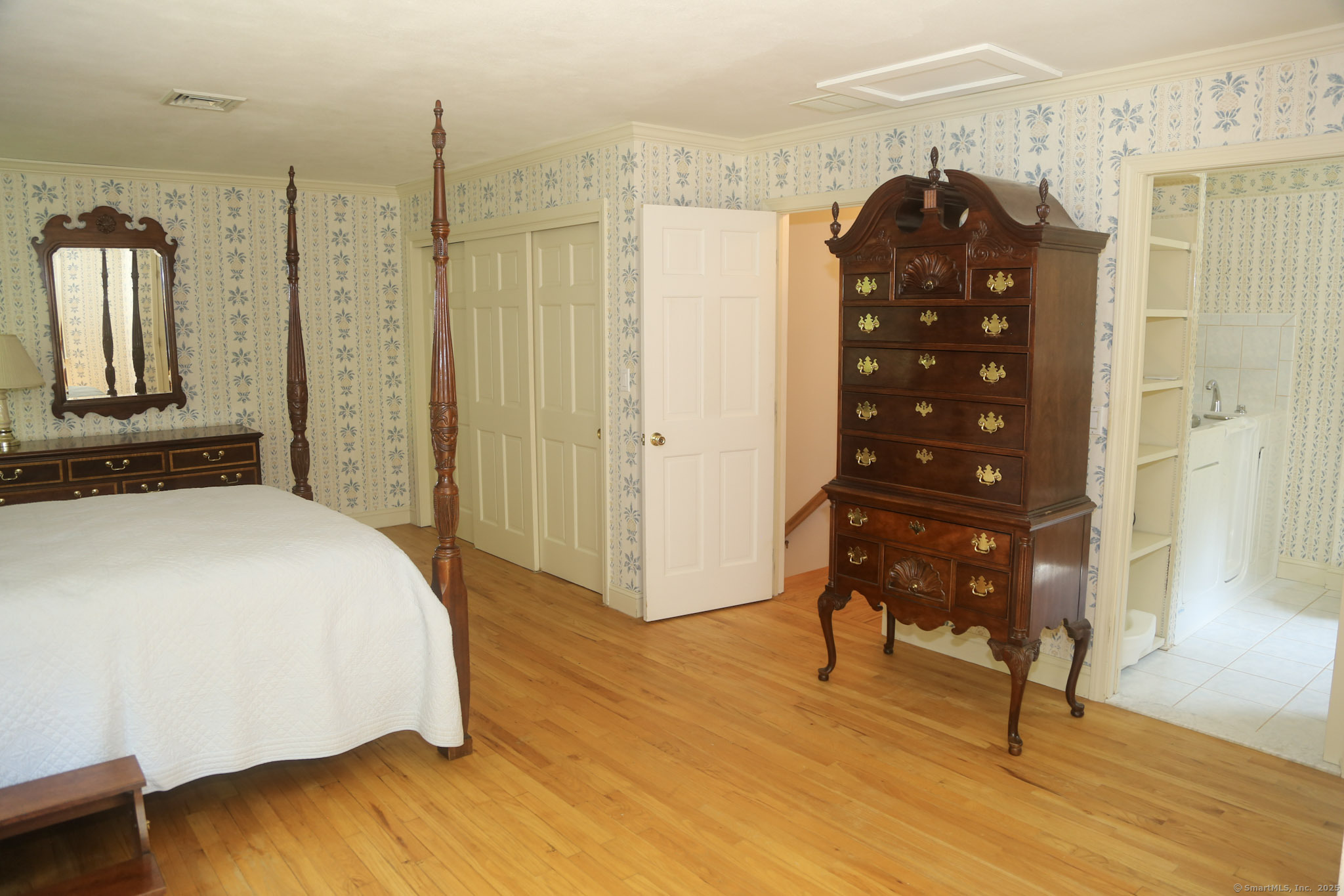 189 Crane Hollow Road Bethlehem, CT 06751 - Photo 11 of 40 a bedroom with a bed and a dresser