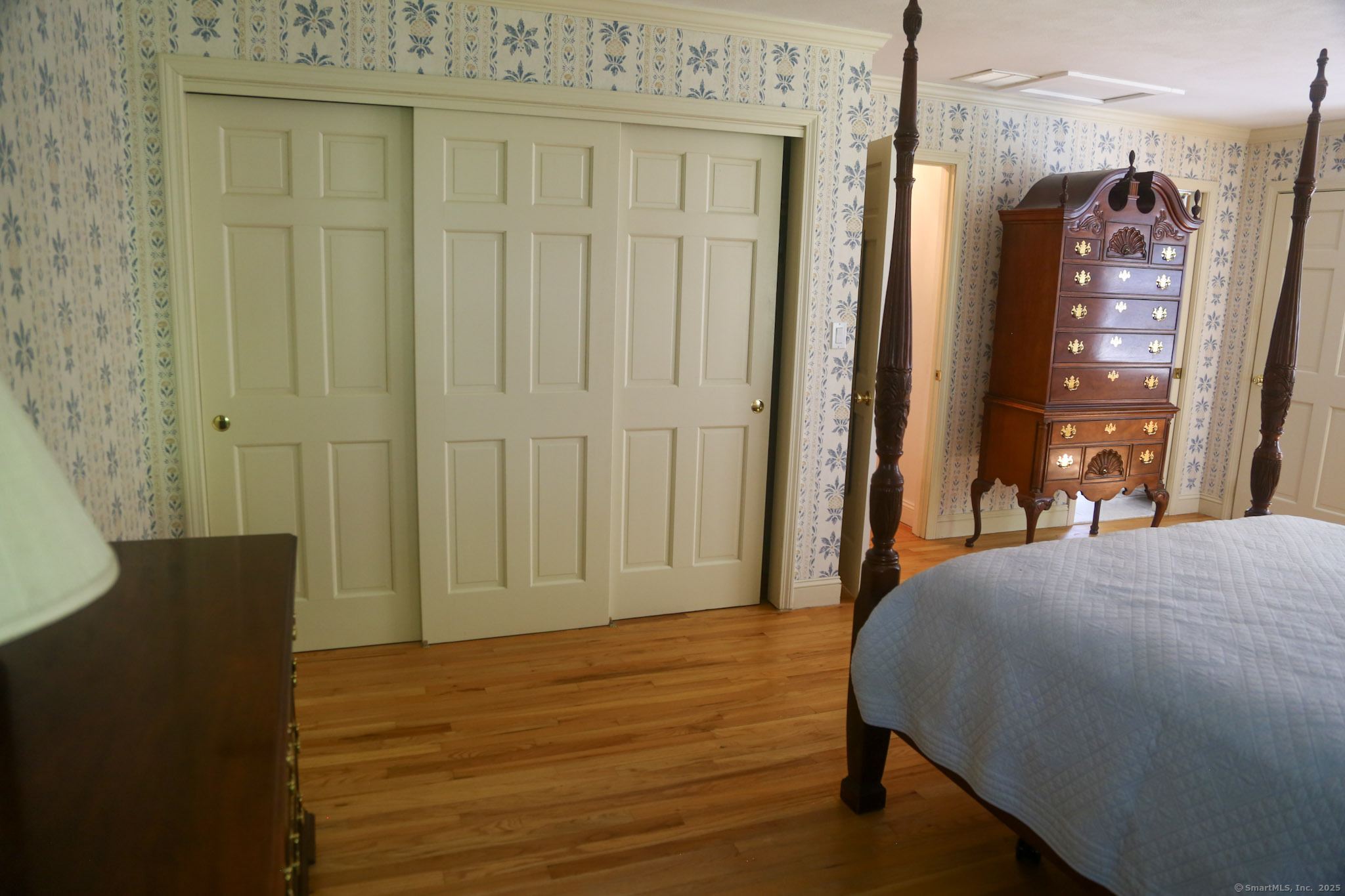 189 Crane Hollow Road Bethlehem, CT 06751 - Photo 12 of 40 a bedroom with a bed and a table