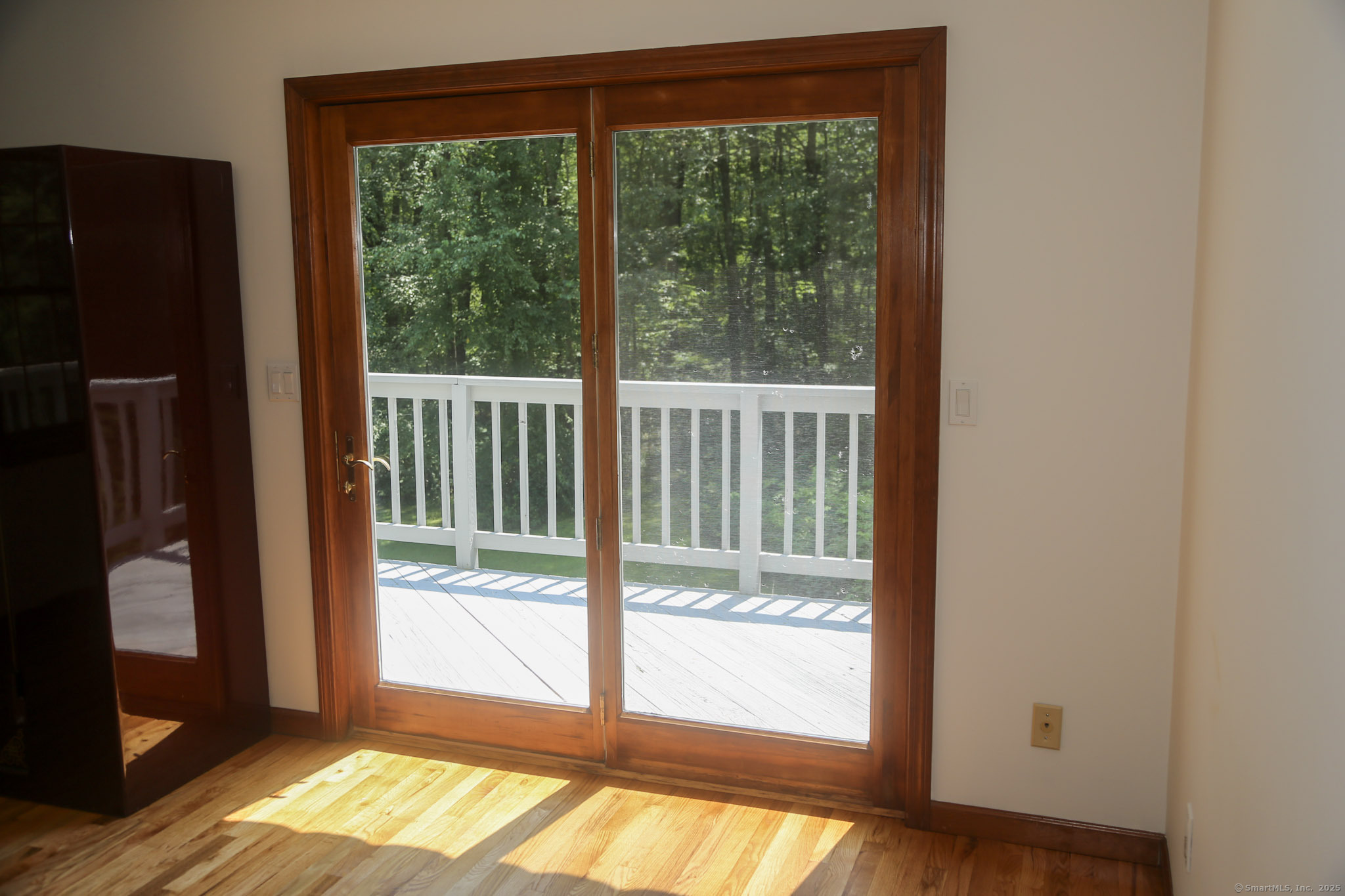 189 Crane Hollow Road Bethlehem, CT 06751 - Photo 16 of 40 a view of empty room with wooden floor and a window