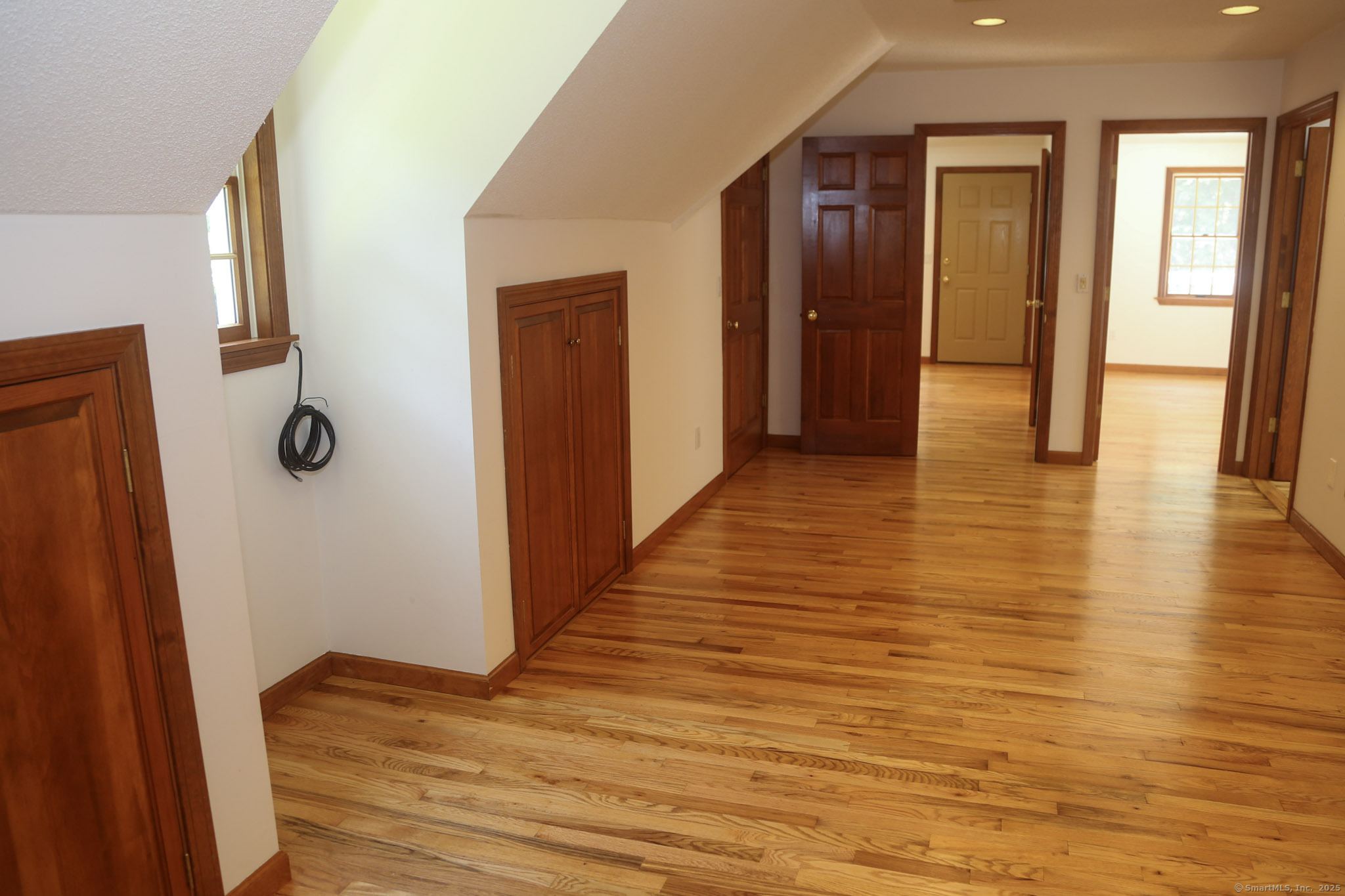189 Crane Hollow Road Bethlehem, CT 06751 - Photo 17 of 40 a view of a hallway with wooden floor
