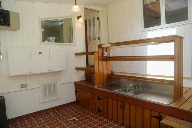 an aerial view of a house with swimming pool and big yard