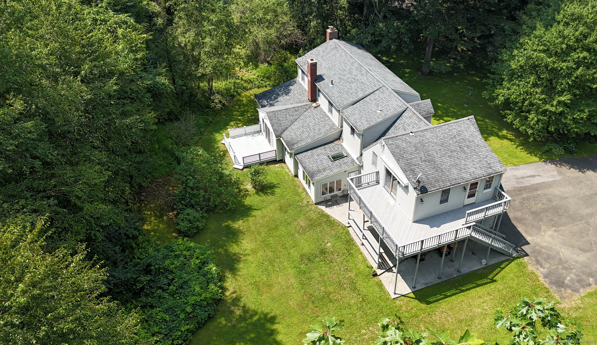 189 Crane Hollow Road Bethlehem, CT 06751 - Photo 20 of 40 an aerial view of a house with swimming pool and big yard