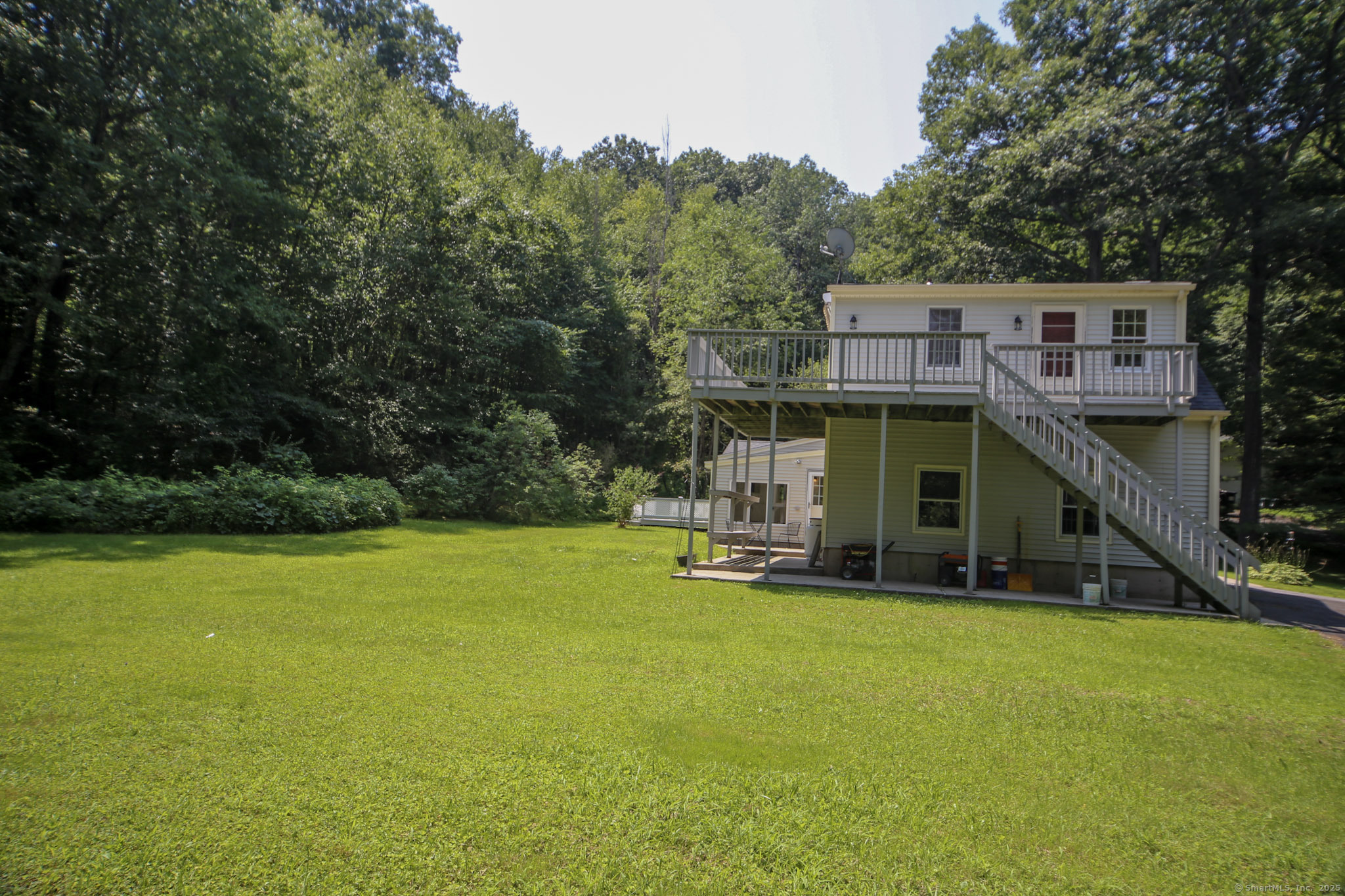 189 Crane Hollow Road Bethlehem, CT 06751 - Photo 22 of 40 a view of a house with a swimming pool