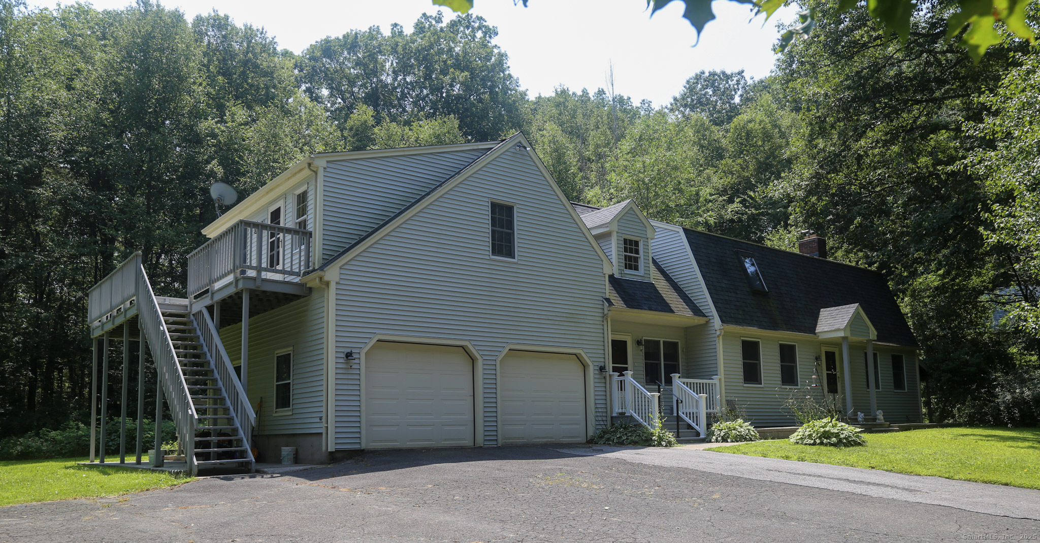 189 Crane Hollow Road Bethlehem, CT 06751 - Photo 24 of 40 a front view of a house with garden