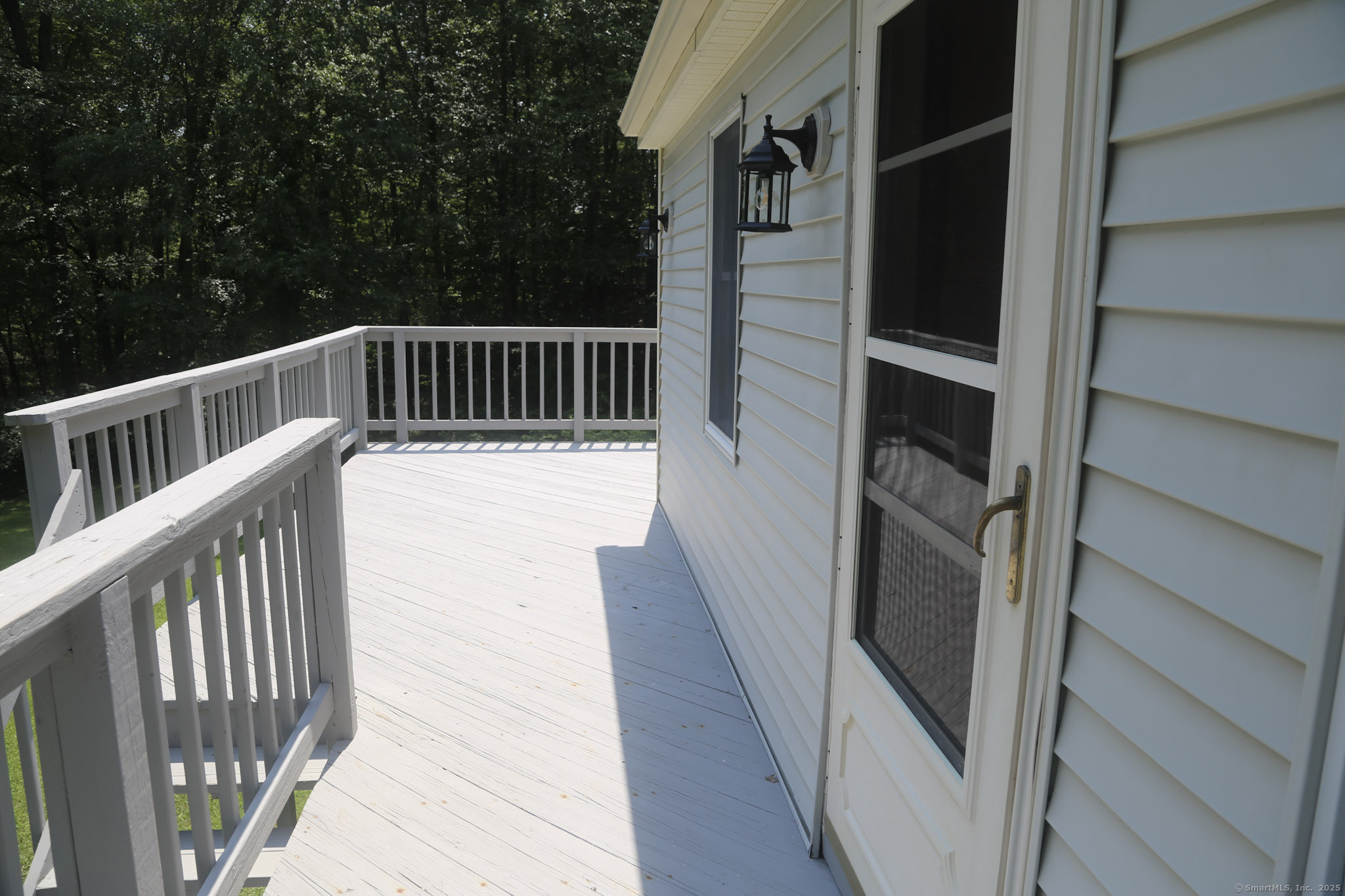 189 Crane Hollow Road Bethlehem, CT 06751 - Photo 25 of 40 a view of a balcony with wooden floor