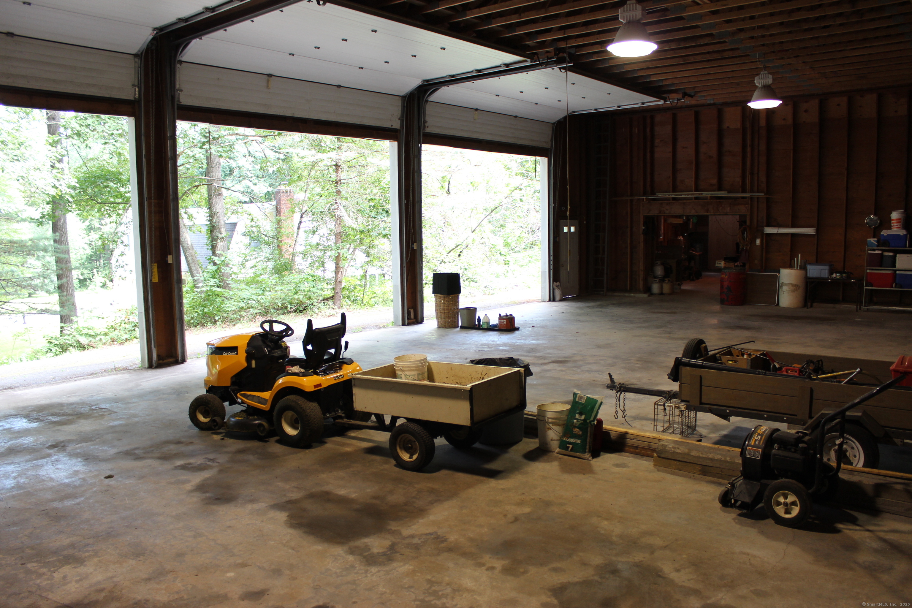 189 Crane Hollow Road Bethlehem, CT 06751 - Photo 35 of 40 a living room with furniture and a fireplace
