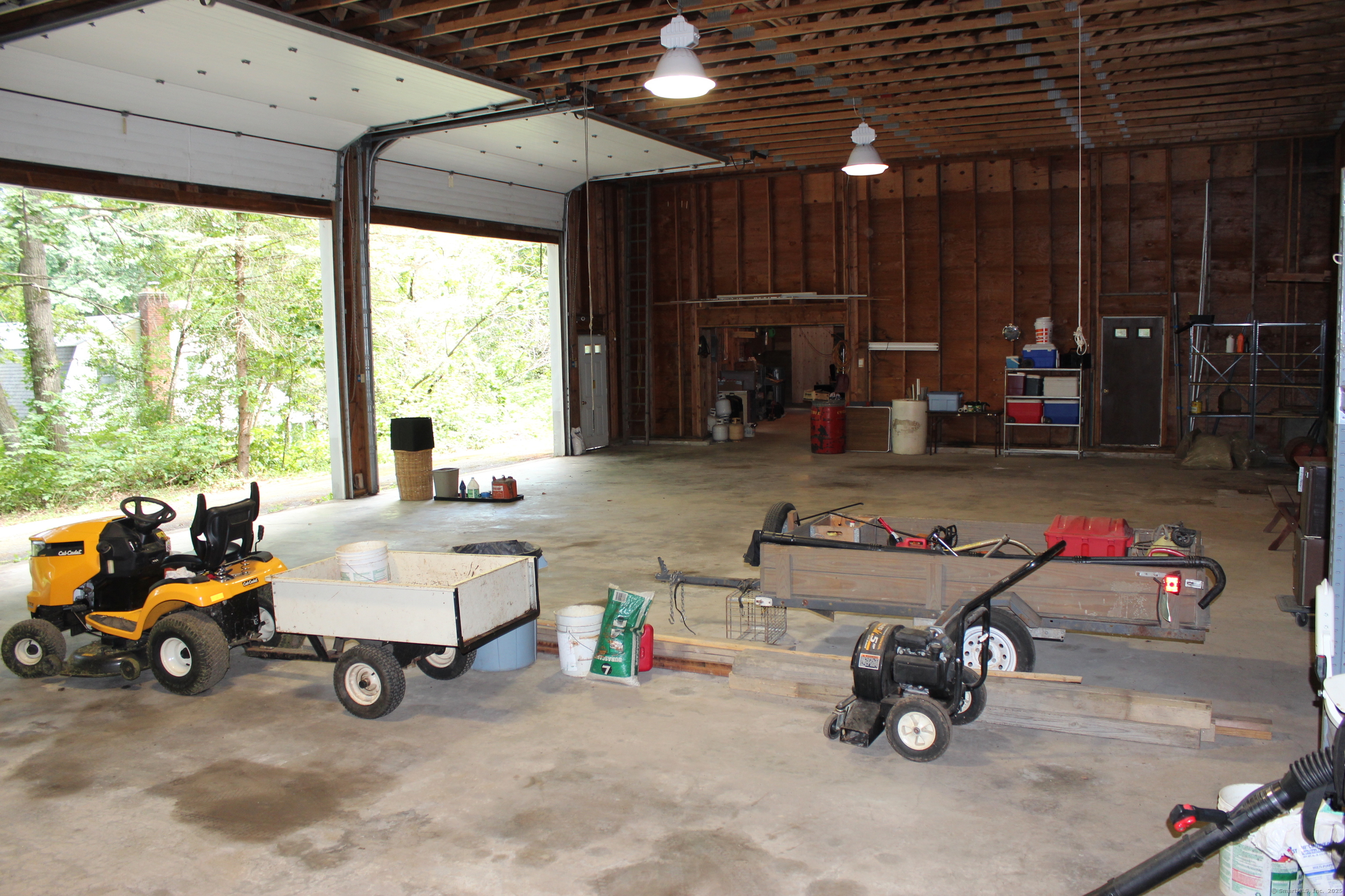189 Crane Hollow Road Bethlehem, CT 06751 - Photo 37 of 40 a living room with furniture and a fireplace