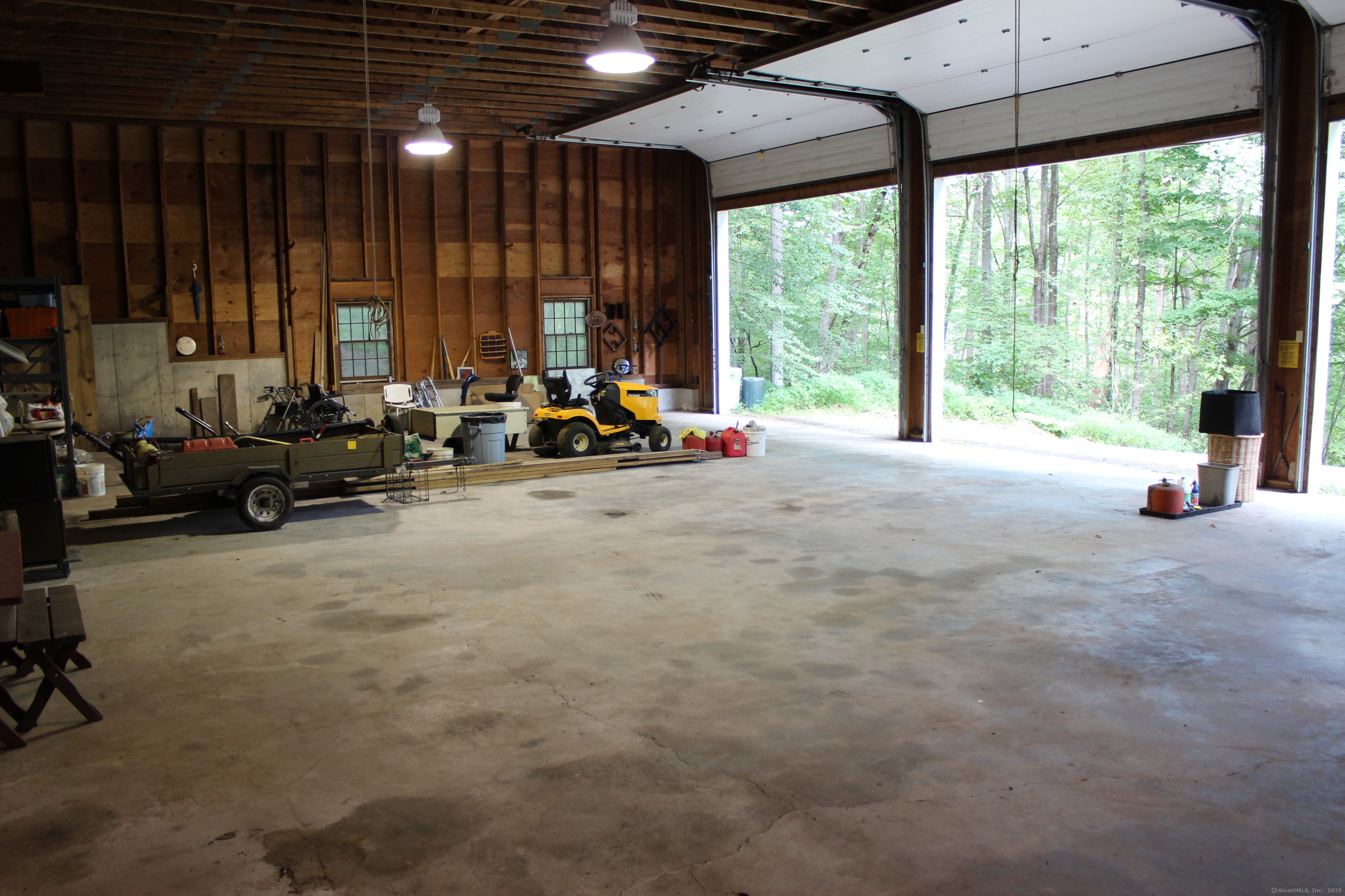 189 Crane Hollow Road Bethlehem, CT 06751 - Photo 38 of 40 a view of a room with gym equipment and large windows