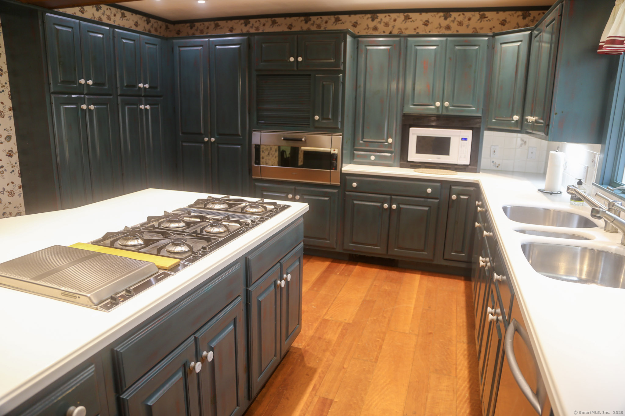 189 Crane Hollow Road Bethlehem, CT 06751 - Photo 6 of 40 a kitchen with a sink and a stove top oven