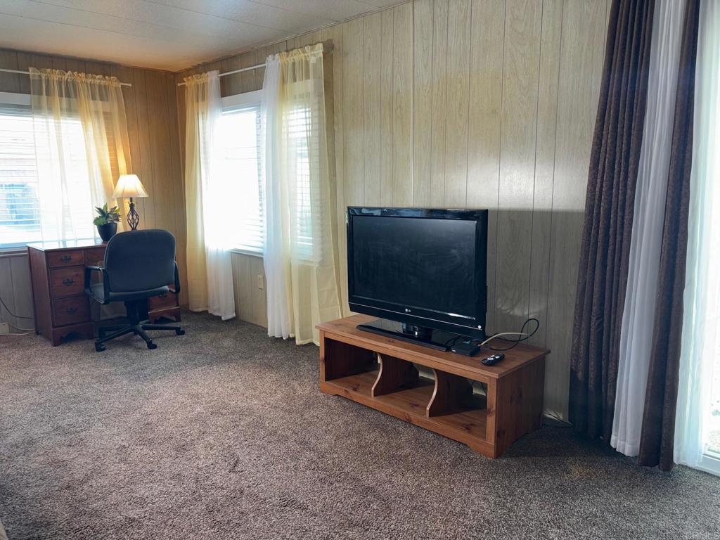 1174 East Main Street, Unit 113 El Cajon, CA 92021 - Photo 11 of 25 a living room with furniture and a flat screen tv