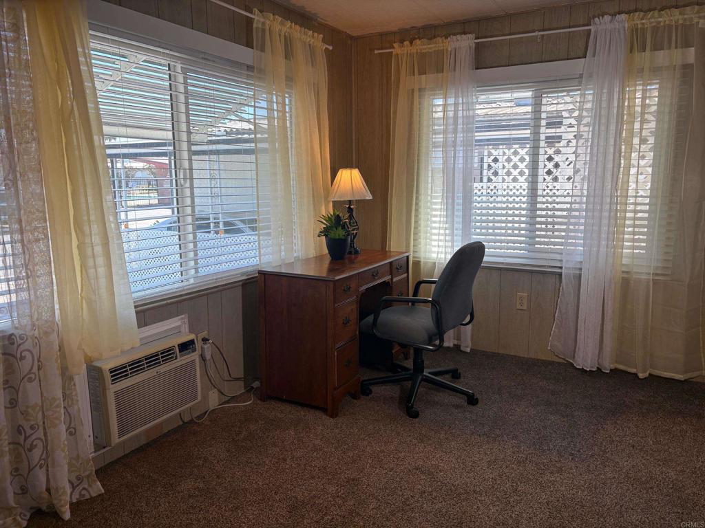 1174 East Main Street, Unit 113 El Cajon, CA 92021 - Photo 12 of 25 a view of a workspace with furniture and a window