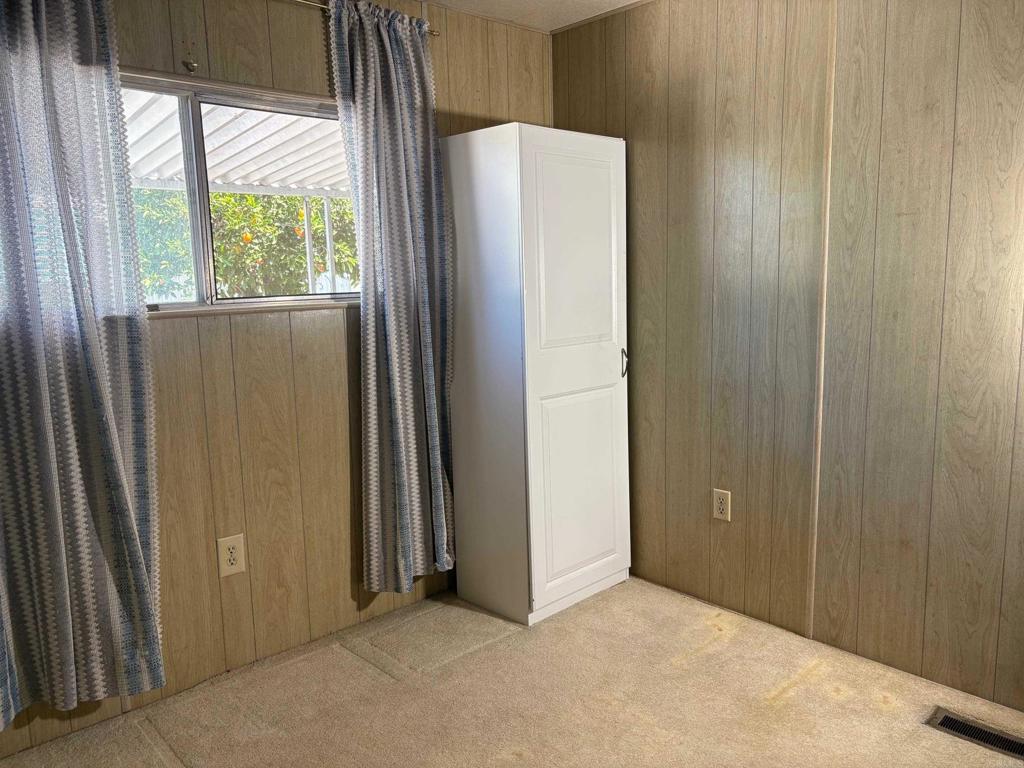 1174 East Main Street, Unit 113 El Cajon, CA 92021 - Photo 15 of 25 an empty room with windows