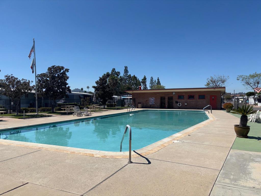 1174 East Main Street, Unit 113 El Cajon, CA 92021 - Photo 23 of 25 a view of a swimming pool with a lounge chairs