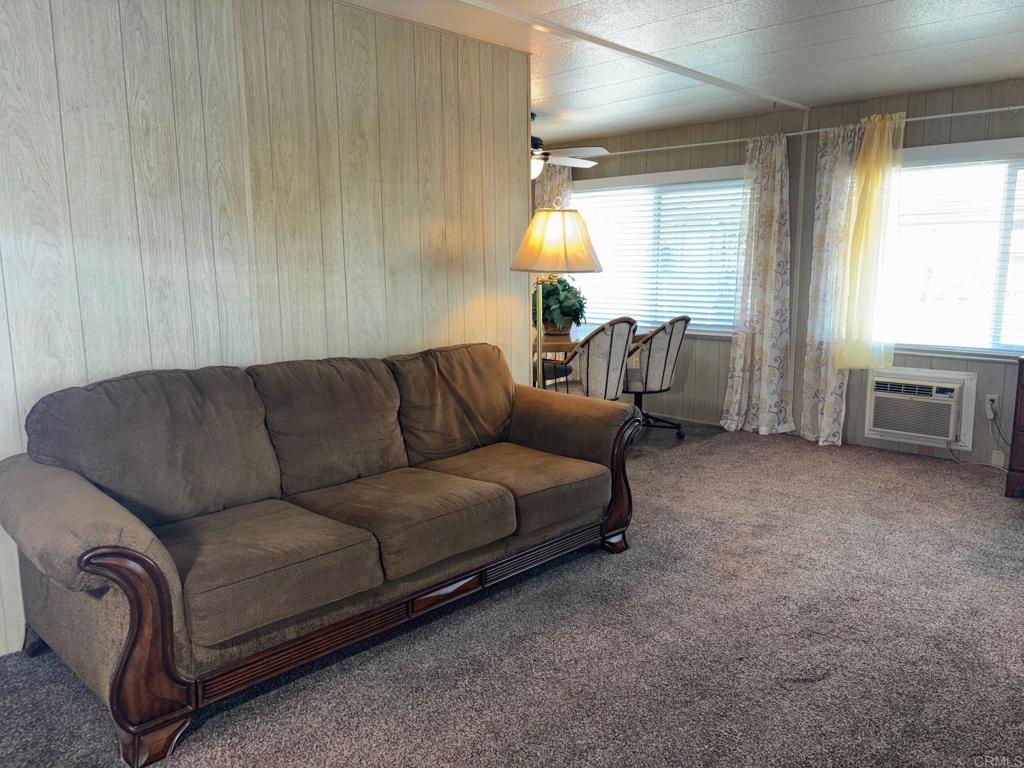1174 East Main Street, Unit 113 El Cajon, CA 92021 - Photo 9 of 25 a living room with furniture and a window