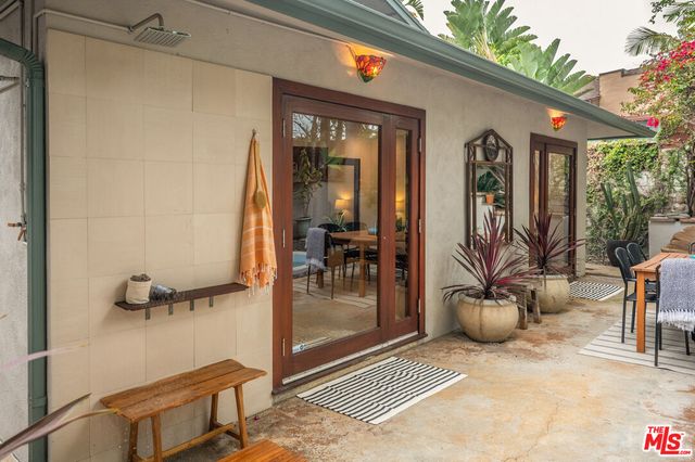 a outdoor view of a house with sitting area