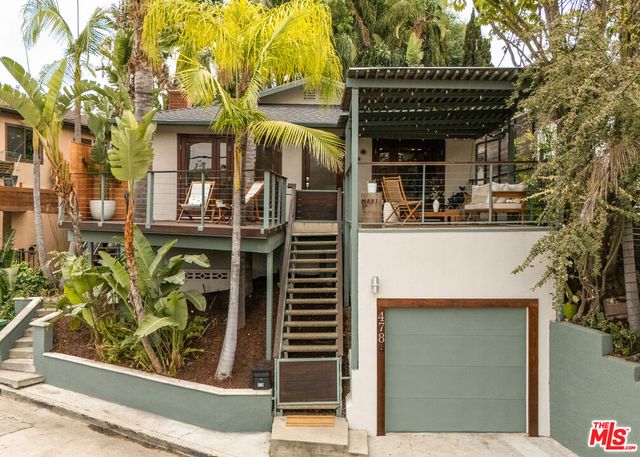 front view of a house with a small yard