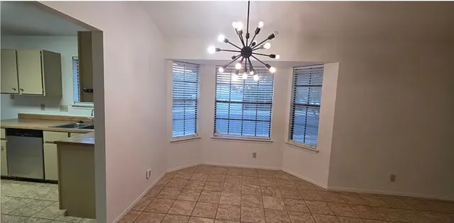 a view of a kitchen from the hallway