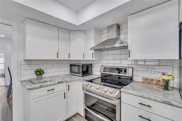 a kitchen with appliances cabinets and a counter top