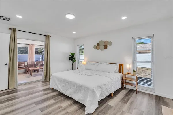 a bedroom with a bed and a table