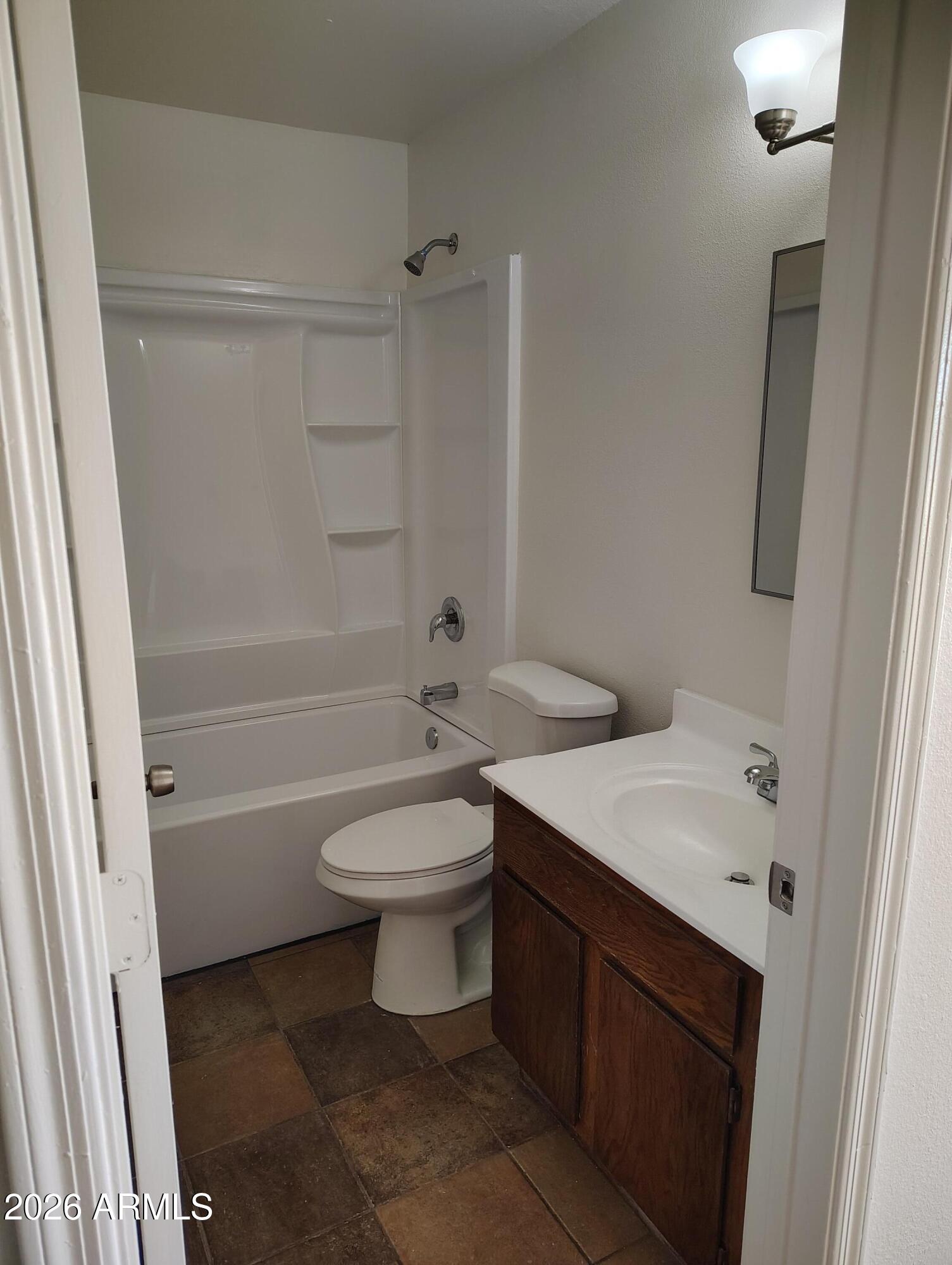 2560 South Yavapai Road Apache Junction, AZ 85119 - Photo 16 of 31 a bathroom with a sink a toilet and shower